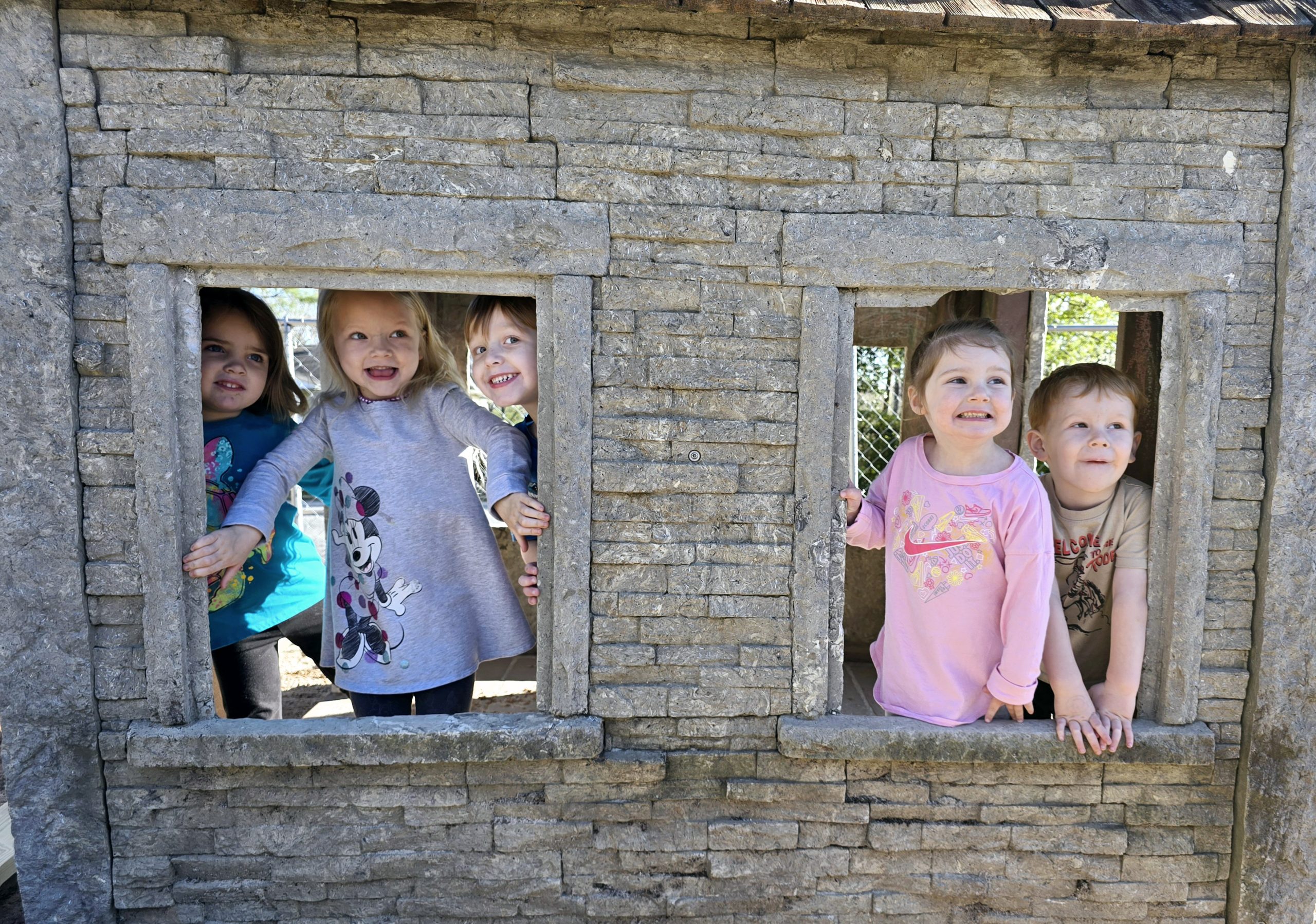 children playing in playset