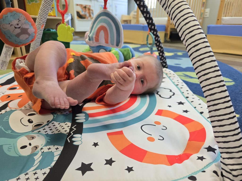 child playing with mobile